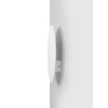 Biały kinkiet ścienny w kształcie koła o średnicy 25cm, do sypialni