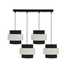 Czarno-biała lampa wisząca z czterema abażurami, nad długi stół