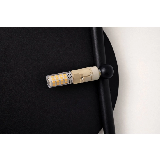 Dekoracyjny, czarny kinkiet ścienny, idealny do każdego wnętrza