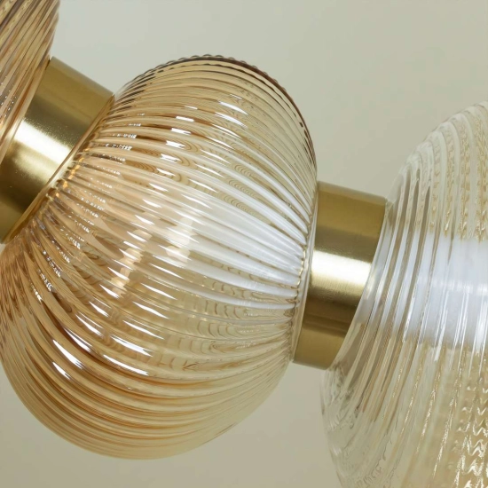 Designerska lampa wisząca LED w kolorze złotym do salonu