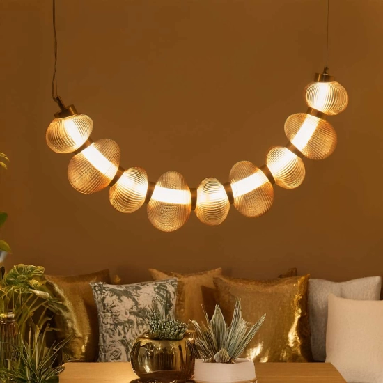 Designerska lampa wisząca LED w kolorze złotym do salonu