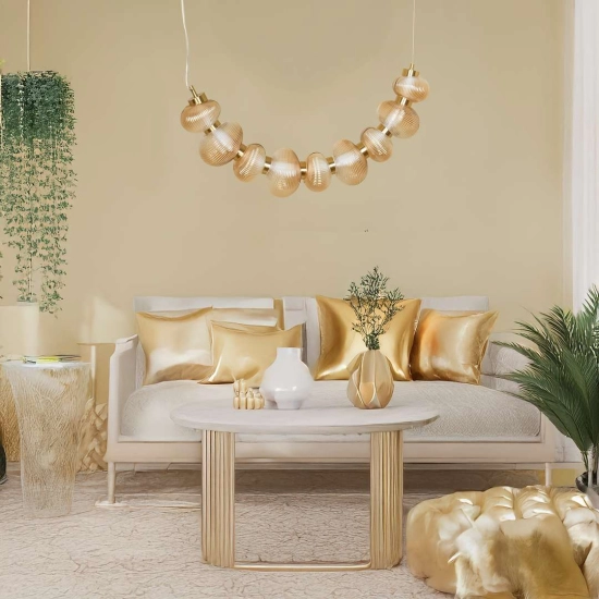 Designerska lampa wisząca LED w kolorze złotym do salonu